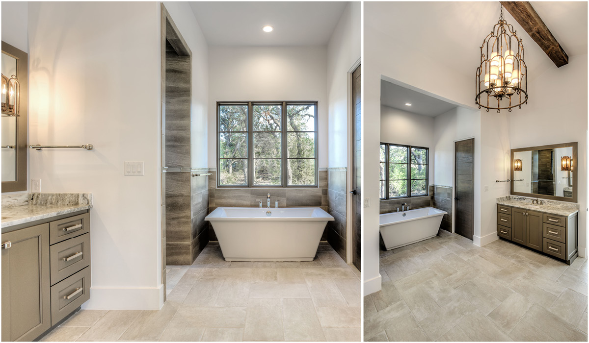 4030-7 Spanish Revival primary bathroom with freestanding soaking tub, double vanities, exposed ceiling beam, and elegant chandelier lighting.