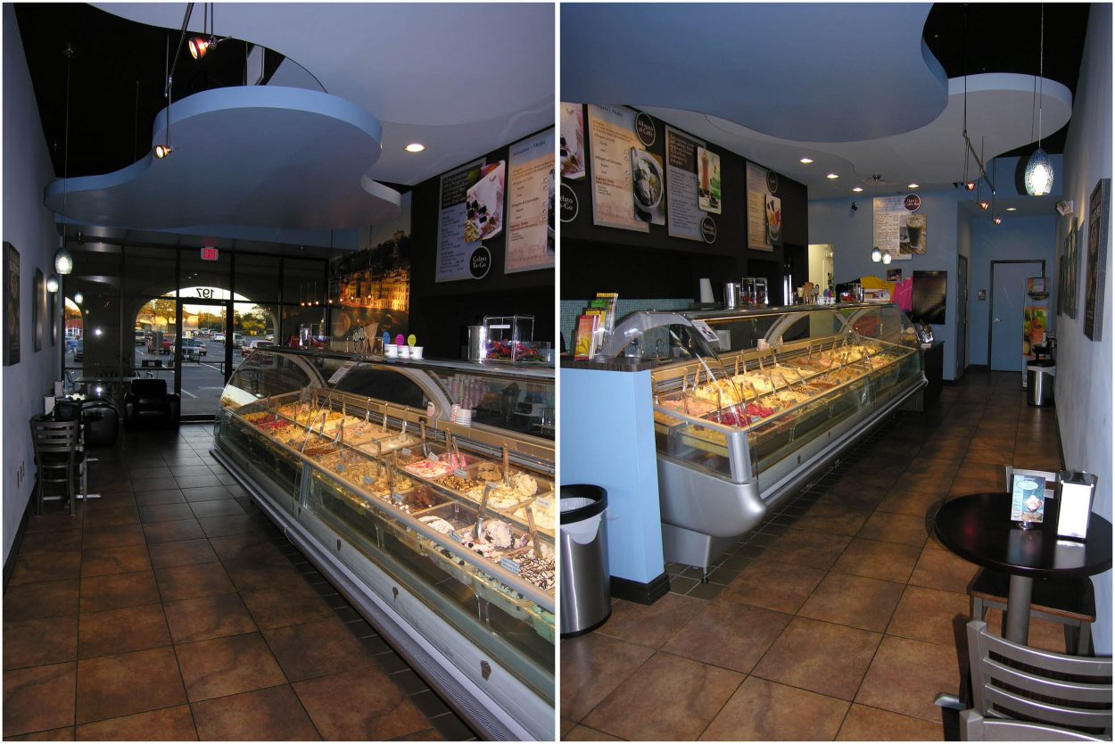 Narrow interior layout of Paciugo gelato shop with curved ceiling design and illuminated gelato display case.