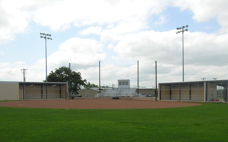 Wide field view of Bandera ISD softball complex with new dugouts, bleachers, and press box.