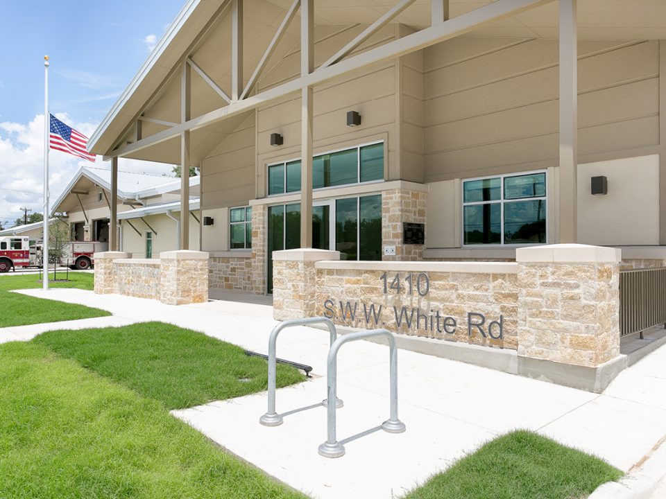 Front entrance with signage – Close-up of fire station front entrance at 1410 S.W.W. White Rd with signage and landscaping.