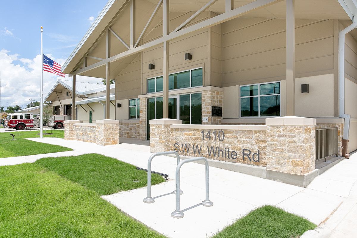 cosa fs18- Front entrance with signage – Close-up of fire station front entrance at 1410 S.W.W. White Rd with signage and landscaping.