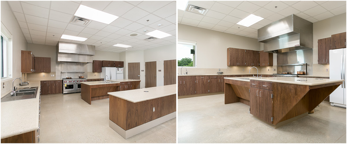 cosa fs18-5 Fire station kitchen – Large modern communal kitchen with island, stainless steel appliances, and wood cabinetry.