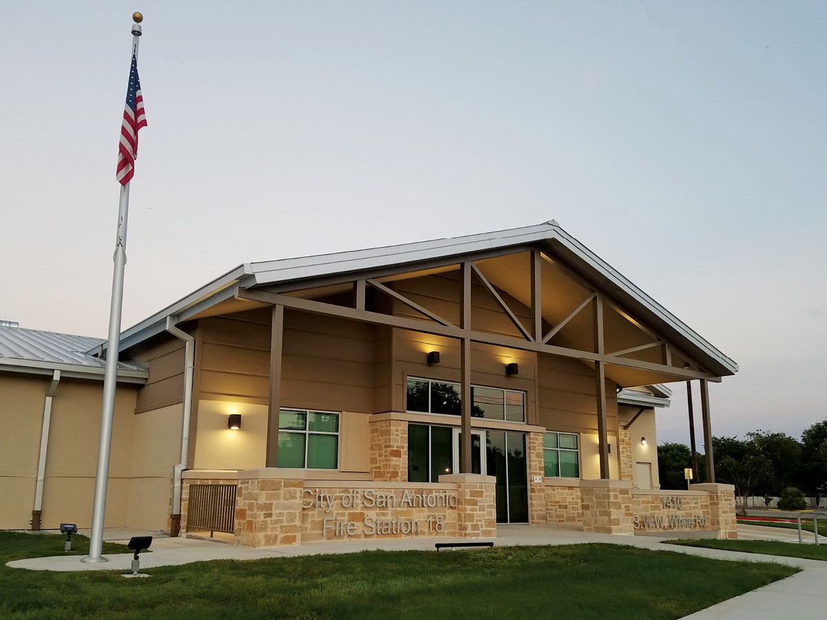 cosa fs18-7 Fire station front with flagpole – Front entrance of Fire Station 18 with stonework, large canopy, and U.S. flag.