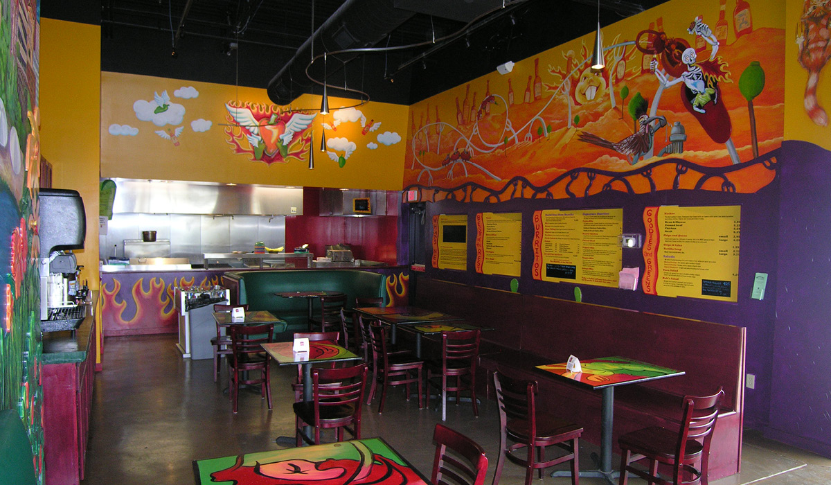 habaneros Alt tag: Dining area of Habanero’s Grill showcasing vibrant wall art, menu boards, and seating arrangements.