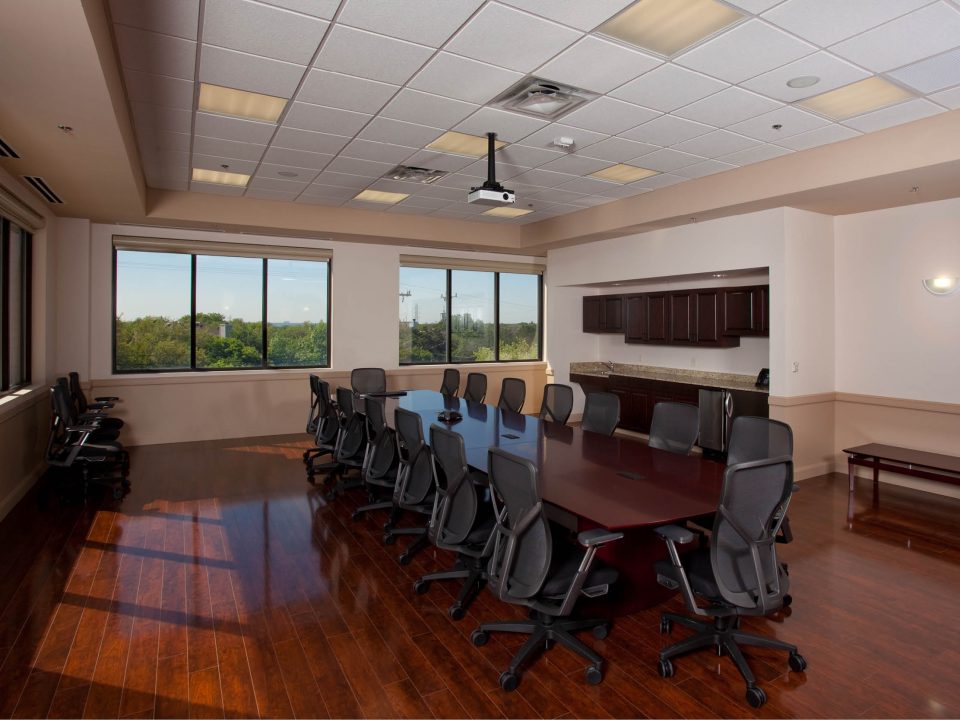 TRI-LIN Office Finish-Out – Spacious conference room with large boardroom table and seating for corporate meetings in San Antonio.