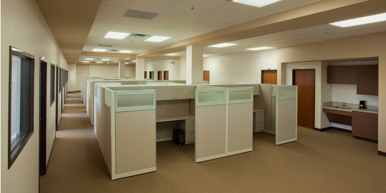 trilin-2 TRI-LIN Office Finish-Out – Open-plan office space with cubicles and workstations designed for TRI-LIN Integrated Services headquarters.