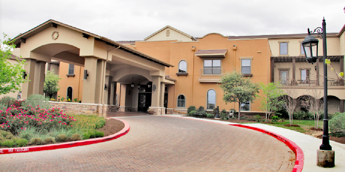 villa SA - Completed porte-cochere addition with landscaped entrance at Villa de San Antonio senior living community.