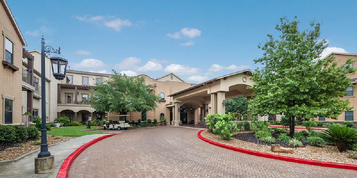 villa SA -3 Exterior view of Villa de San Antonio with new porte-cochere entrance addition providing covered access.