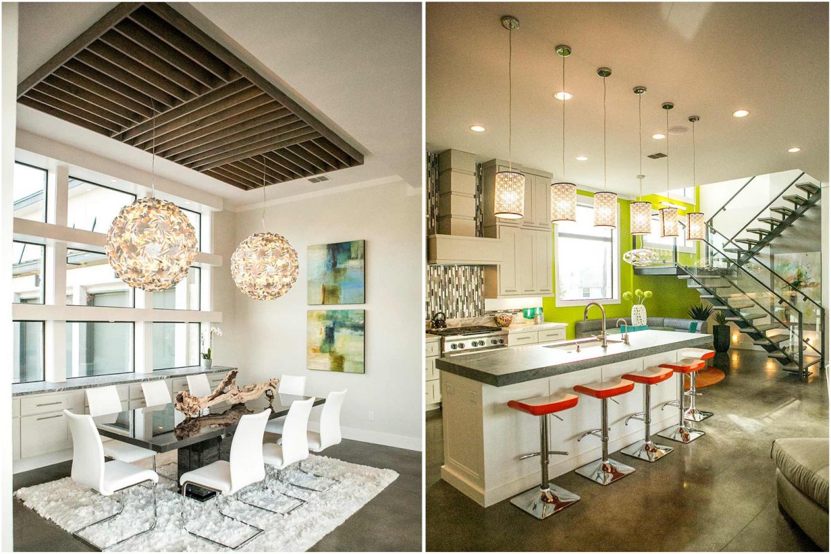 Contemporary open-concept dining and kitchen area featuring a glass dining table with white chairs, artistic pendant lights, and a modern kitchen island with bold orange barstools under statement lighting.