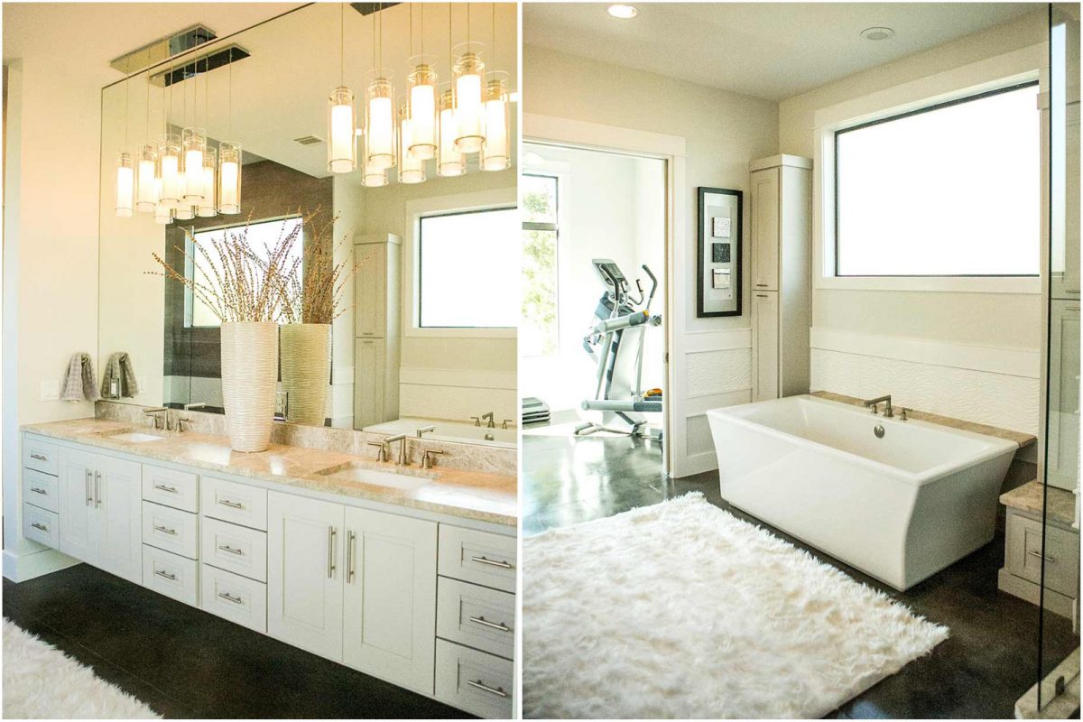 Modern bathroom with double vanity, marble countertops, rectangular soaking tub, and large wall mirror under contemporary pendant lights.