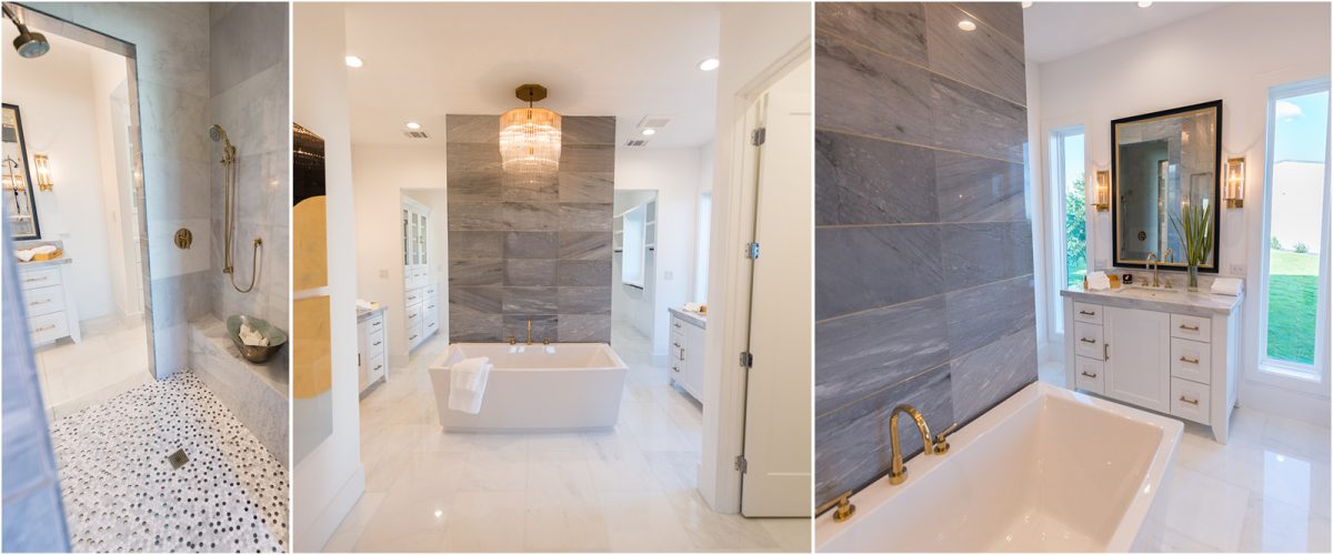 3674-10 Elegant bathroom with a freestanding tub, marble tile accents, walk-in shower, and double vanities with gold fixtures and modern lighting.