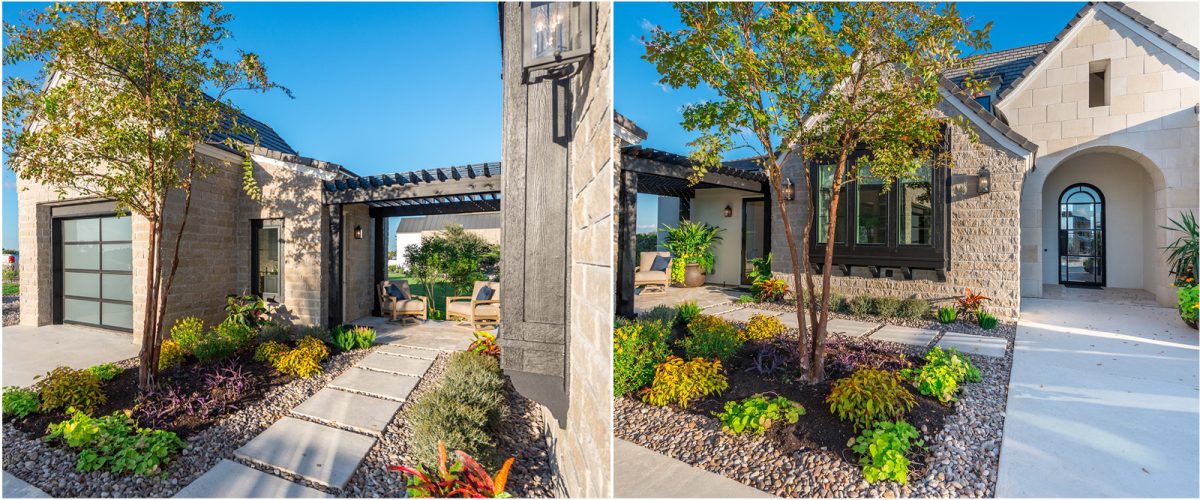 Stone walkway leading through landscaped courtyard with seating area, trees, and arched entry to a modern French country home.