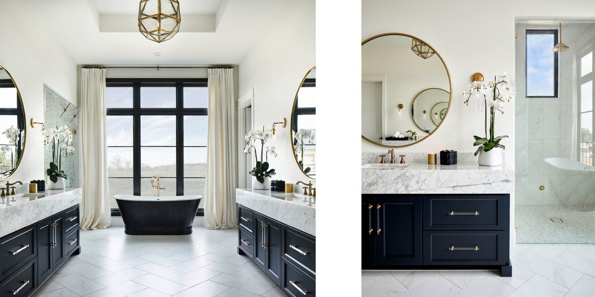 Bright bathroom retreat with freestanding tub, dual vanities, and expansive tall windows for natural light